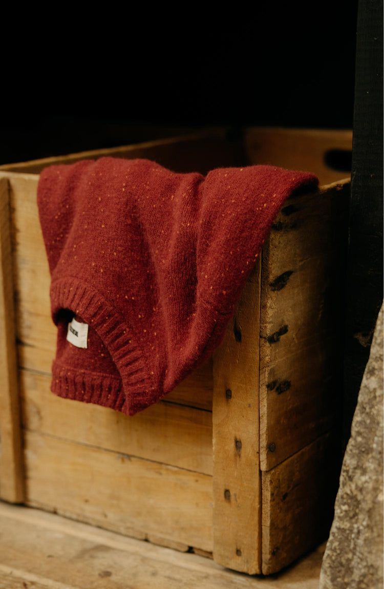 editorial image of The Lodge Sweater in Bonfire Donegal in a box