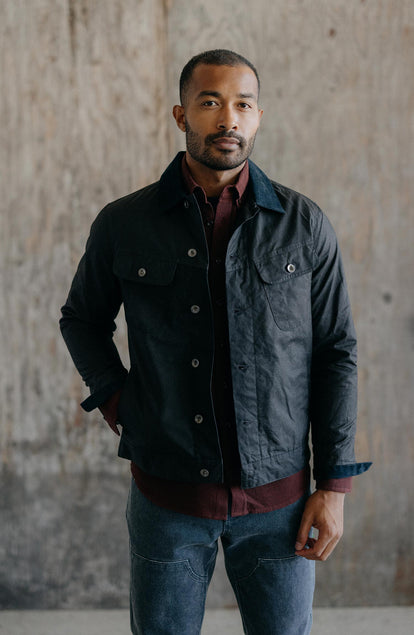 fit model showing off The Long Haul Jacket in Coal Waxed Canvas