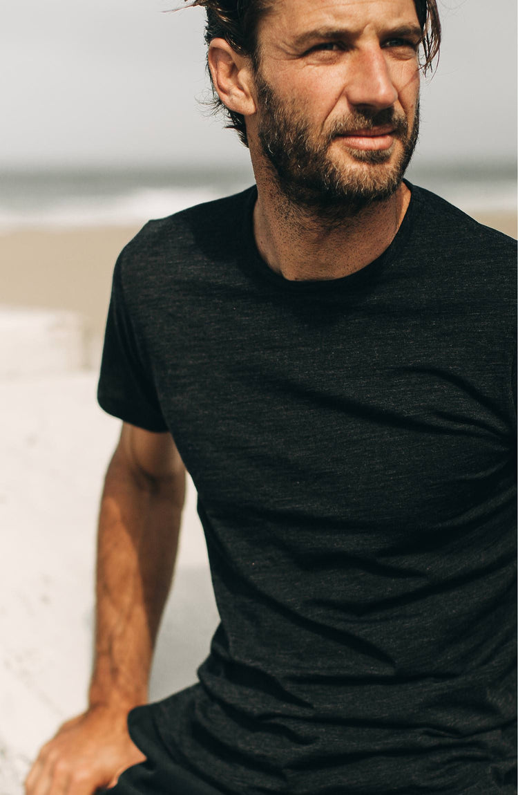 our guy rocking the merino tee near the beach