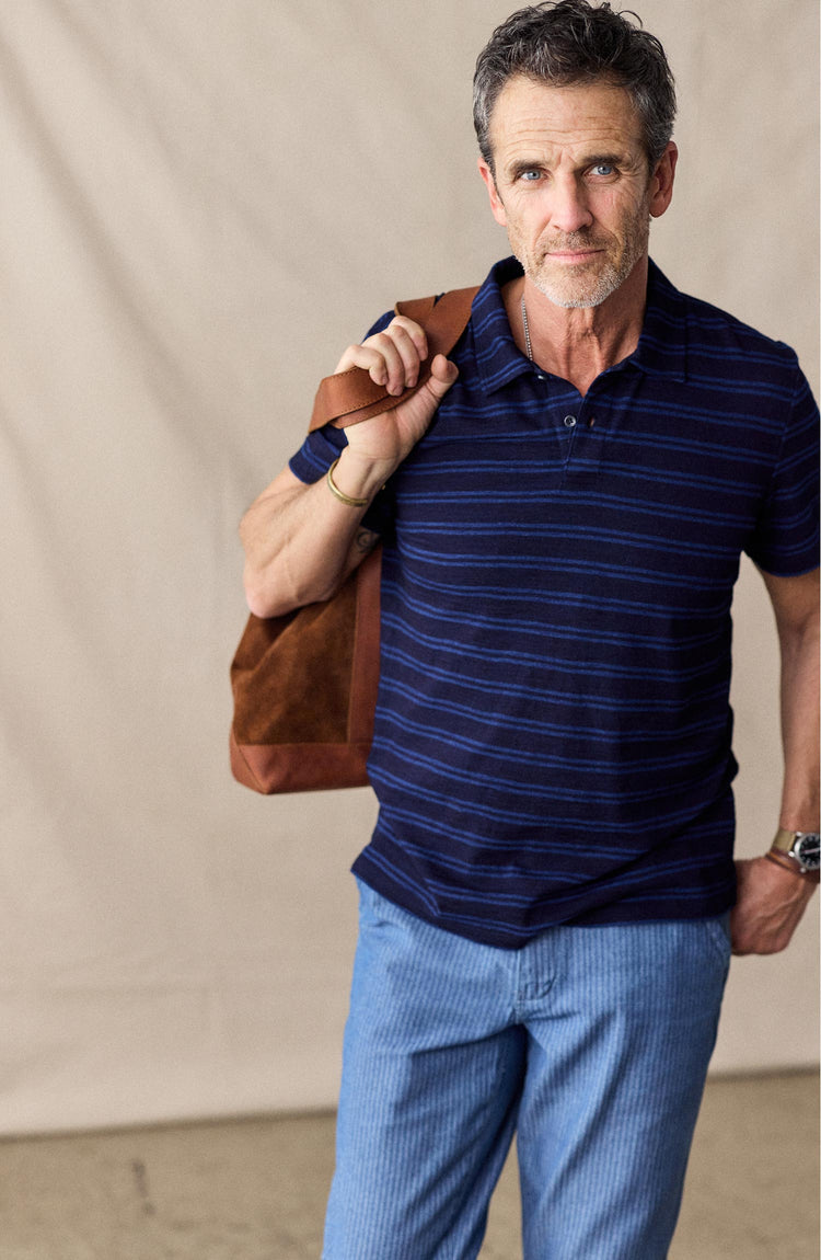 fit model posing in The Organic Cotton Polo in Rinsed Indigo Stripe