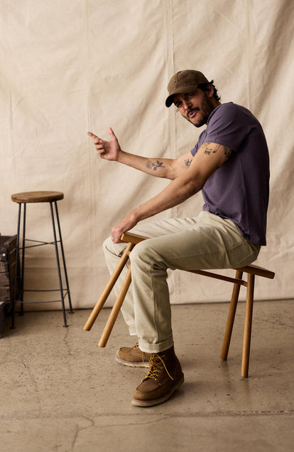 fit model walking wearing The Organic Cotton Tee in Faded Brick