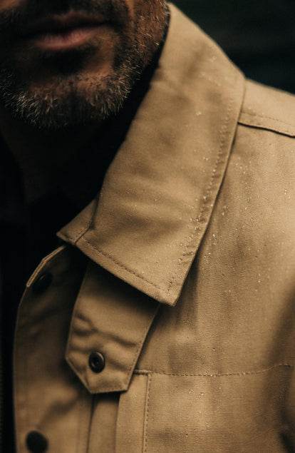 fit model showing off the collar on The Pathfinder Jacket in Khaki Dry Wax