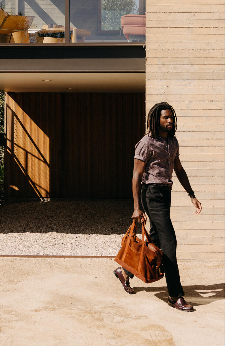 fit model walking wearing The Thomas Trouser in Coal Linen Twill