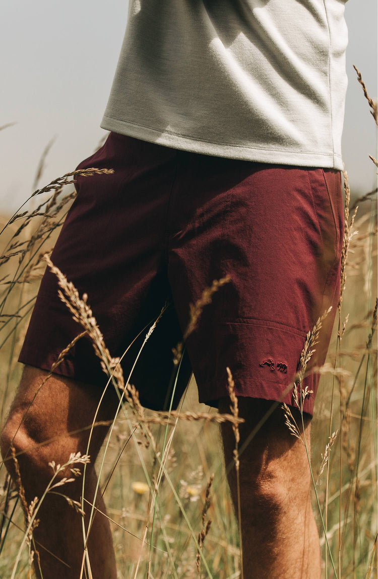 Our guy rocking The Tracksmith Collection traverse short, on trail