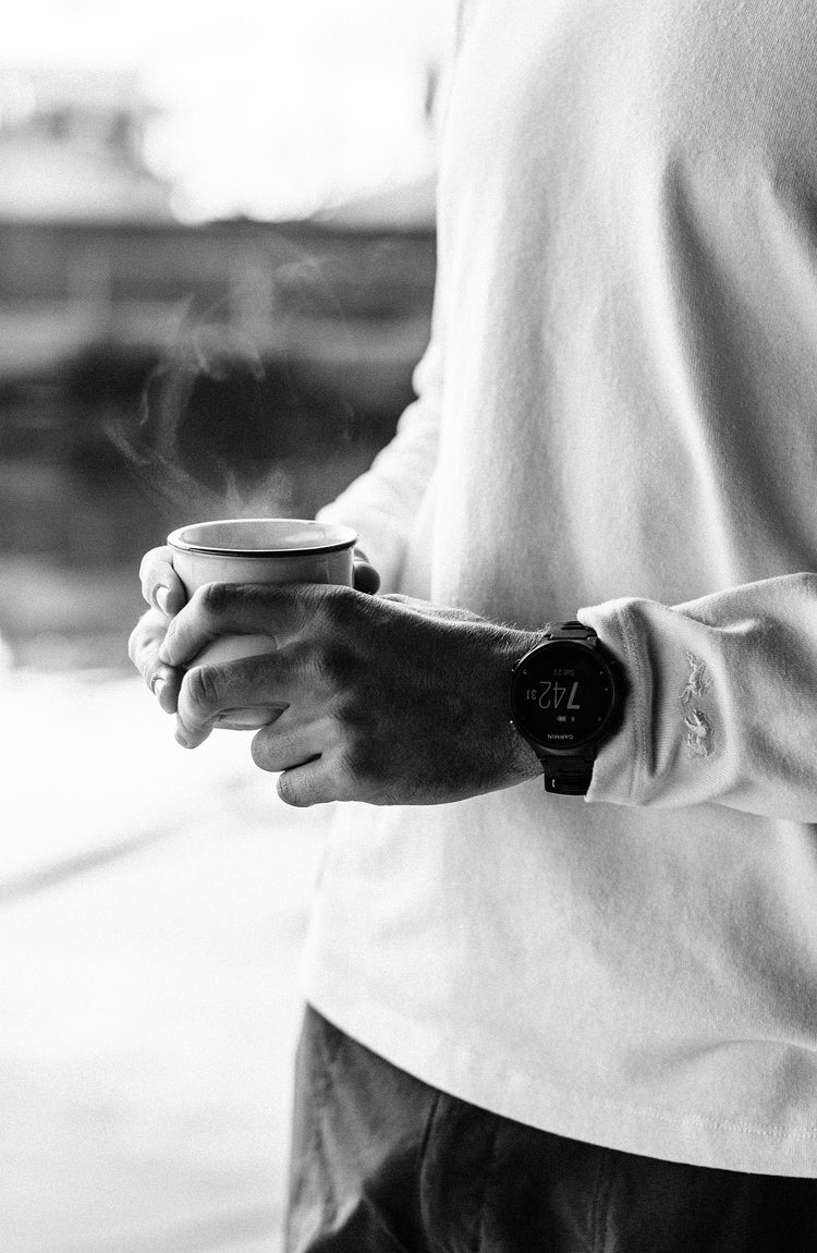 Our guy rocking The Tracksmith Collection long sleeve heavy bag, on a house boat, text overlaying