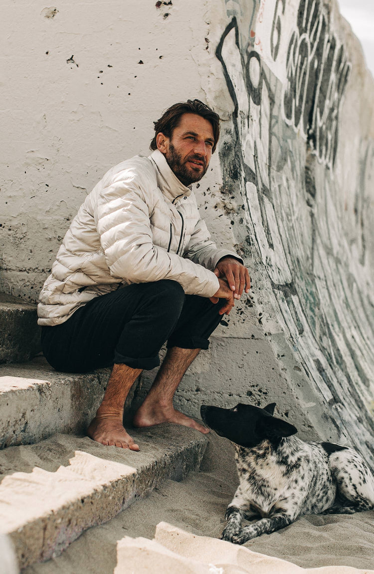 our model wearing the jacket near the coast with text overlaying