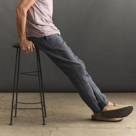 fit model sitting in The Apres Pant in Navy Linen Tweed, Bottoms by Taylor Stitch