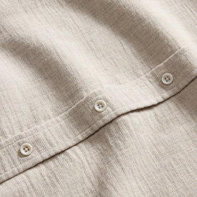 material shot of the buttons on The California in Oat Heather Double Cloth, Wovens by Taylor Stitch