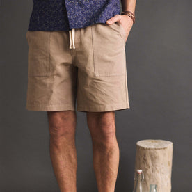 fit model with his hand in his pocket wearing The Apres Trail Short in Dried Earth Slub, Bottoms by Taylor Stitch