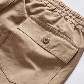 material shot of the back pocket on The Apres Trail Short in Dried Earth Slub, Bottoms by Taylor Stitch