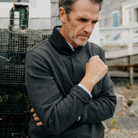 fit model crossing his arms in The Horizon Shawl Pullover in Coal Heather, Knits by Taylor Stitch