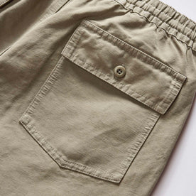 material shot of the back pocket on The Apres Trail Short in Light Sage Slub, Bottoms by Taylor Stitch