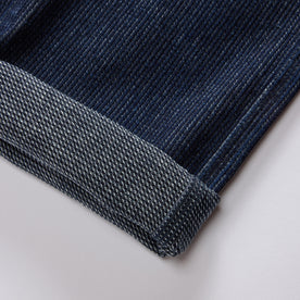 material shot of the cuffs on The Morse Pant in Rinsed Indigo Stripe, Bottoms by Taylor Stitch