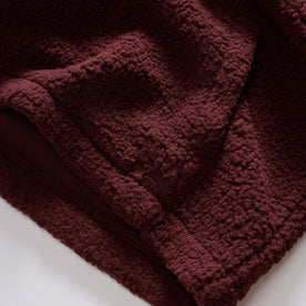 material shot of the kangaroo pocket on The Nomad Hoodie in Burgundy Sherpa, Outerwear by Taylor Stitch