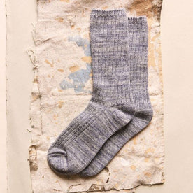 The Rib Sock in Ash Melange on a textured surface, Accessories by Taylor Stitch