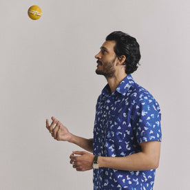 fit model throwing a ball wearing The Short Sleeve California in Dark Navy Ginkgo, Wovens by Taylor Stitch