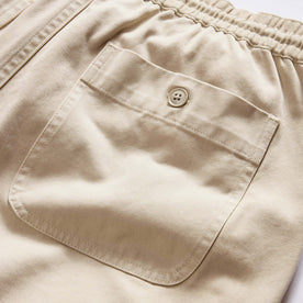 material shot of the back pocket on The Apres Short in Organic Aged Stone Foundation Twill, Bottoms by Taylor Stitch