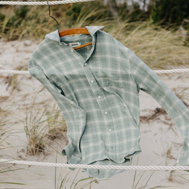 material shot of The California in Sea Moss Plaid on a hanger in the wind, Wovens by Taylor Stitch