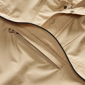 material shot of the hidden pocket on The Chapman Anorak in Light Khaki, Outerwear by Taylor Stitch