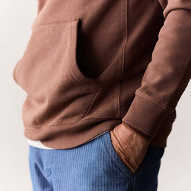 fit model showing the kangaroo pocket on The Cotton Hemp Hoodie in Faded Brick, Knits by Taylor Stitch