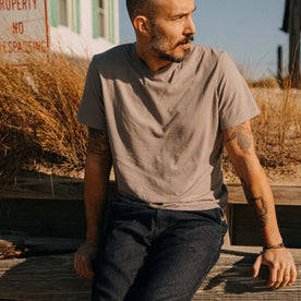 fit model sitting wearing The Cotton Hemp Tee in Steeple Grey, Knits by Taylor Stitch