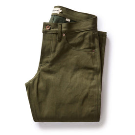 folded flatlay of The Democratic Jean in Olive Nihon Menpu Selvage, Bottoms by Taylor Stitch