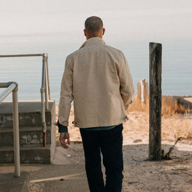 fit model walking wearing The Flint Jacket in Light Khaki Broken Twill, Outerwear by Taylor Stitch