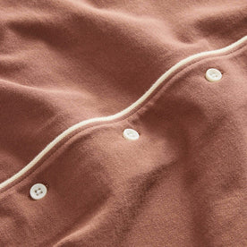 material shot of the buttons on The Harwich Shirt in Faded Brick Tipped Pique, Knits by Taylor Stitch