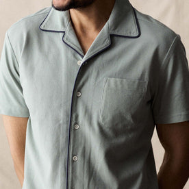 fit model showing off the buttons on The Harwich Shirt in Surf Green Tipped Pique, Knits by Taylor Stitch