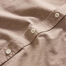 material shot of the natural-colored buttons on The Jack in Faded Brick Chambray, Wovens by Taylor Stitch