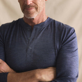 fit model with his arms crossed wearing The Merino Henley in Heather Navy, Knits by Taylor Stitch