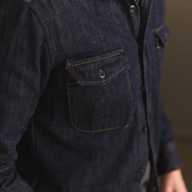 fit model showing off the pockets on The Mill Shirt Jacket in Kuroki Slub Denim, Outerwear by Taylor Stitch