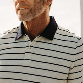 fit model showing off the collar on The Organic Cotton Polo in Bleached Natural Stripe, Knits by Taylor Stitch