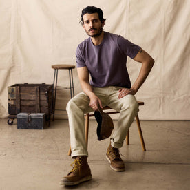 fit model sitting in The Organic Cotton Tee in Dried Plum, Knits by Taylor Stitch