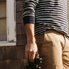 fit model showing off cuffs on The Organic Cotton Henley in Rinsed Indigo Stripe, Knits by Taylor Stitch