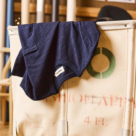 editorial image of The Organic Cotton Tee in Rinsed Indigo in a bin, Knits by Taylor Stitch