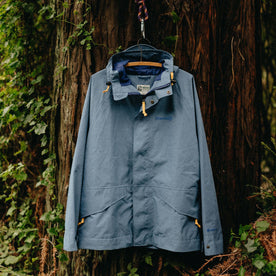 The Owens Parka in Moonlight Gore-Tex hanging in the woods, Outerwear by Taylor Stitch