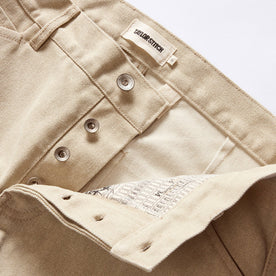 material shot of the button fly on The Camp Pant in Light Khaki Chipped Canvas, Bottoms by Taylor Stitch