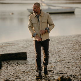 fit model walking in The Workhorse Utility Jacket in Light Khaki Chipped Canvas, Outerwear by Taylor Stitch