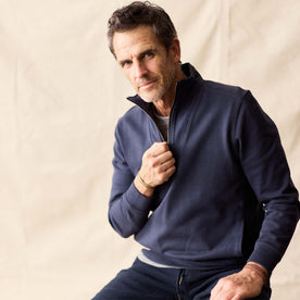 fit model unzipping The Rugby Quarter Zip in Faded Navy , Knits by Taylor Stitch