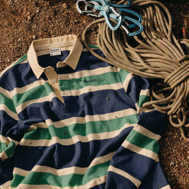 The Rugby Shirt in Navy Stripe next to climbing rope, Knits by Taylor Stitch