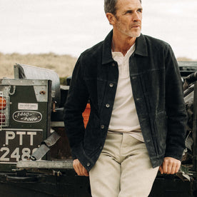 fit model sitting against a jeep in The Ryder Jacket in Dark Navy Suede, Outerwear by Taylor Stitch