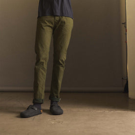 fit model showing off The Slim Jean in Olive Nihon Menpu Selvage, Bottoms by Taylor Stitch