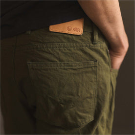 fit model showing back pocket on The Slim Jean in Olive Nihon Menpu Selvage, Bottoms by Taylor Stitch