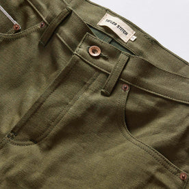 material shot of the waistband on The Slim Jean in Olive Nihon Menpu Selvage, Bottoms by Taylor Stitch