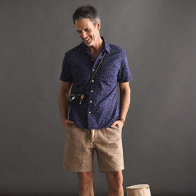 fit model posing in The Short Sleeve Hawthorne in Dark Navy Floral, Wovens by Taylor Stitch