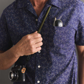 fit model showing off pocket on The Short Sleeve Hawthorne in Dark Navy Floral, Wovens by Taylor Stitch