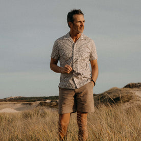 fit model posing in The Short Sleeve Hawthorne in Fig Floral, Wovens by Taylor Stitch