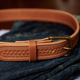 editorial image of The Tooled Belt in Saddle Tan clasped, Accessories by Taylor Stitch