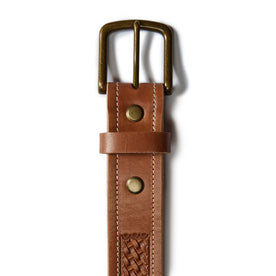 flatlay of the belt buckle The Tooled Belt in Saddle Tan, Accessories by Taylor Stitch